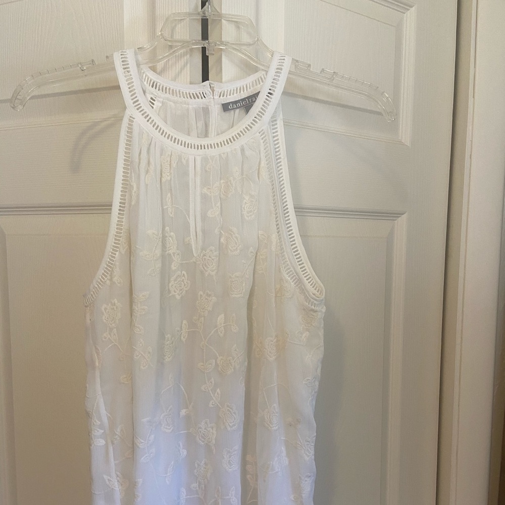 White sleeveless blouse.